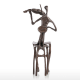 "violin player" bronze figurine