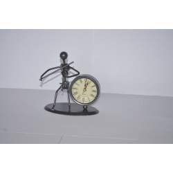 violinist sculpture with clock